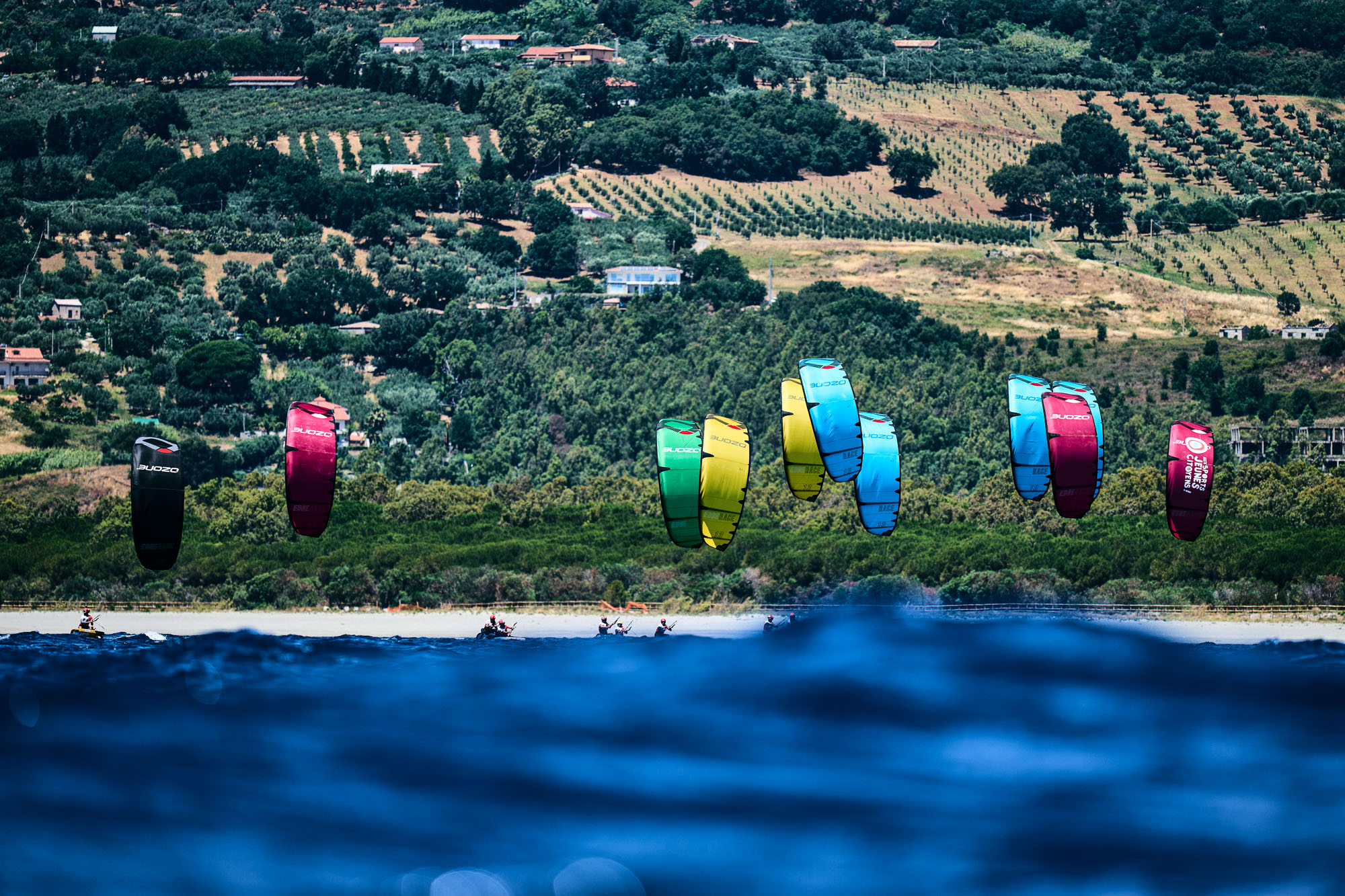 colorful youthfoil kites against the mediterranean backdrop of calabria